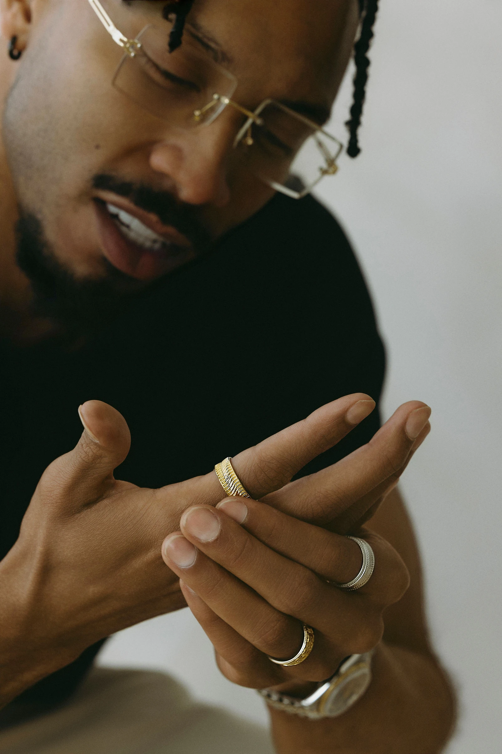Close view of rings on a model’s hands